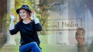 Heather Cox smiling in front of social media whiteboard