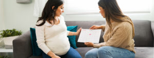 Health counselor assisting pregnant woman